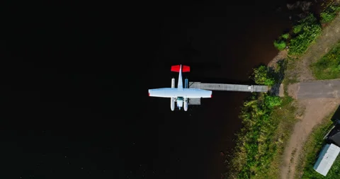 Top down drone shot above a sea plane, sunny summer day in Inari, Finland Stock Footage 279123600