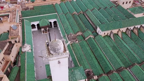 Top Down Drone Shot of Al Quaraouiyine Minaret and Green Rooftops in Fez Morocco Stock Footage 335209582