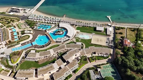 Top down drone shot of beachfront resort with pools and beach in Halkidiki. Stock Footage 327663977