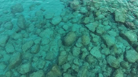 Top-Down Drone Shot of Clear Turquoise Sardinian Sea with Visible Rocks Stock Footage 332559148