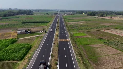 Top Down Drone Shot of Delhi-Mumbai Expressway Traffic and Green Landscape Stock Footage 331765093