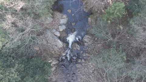 Top Down Drone Shot Descending Over Small Waterfall in Forest River – 4K Stock Footage 325408535