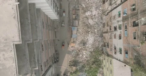 Top Down Drone Shot of Dhaka’s Garment Industry and Waste Stock Footage 319476032