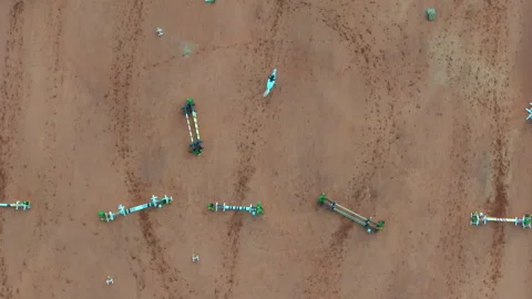 Top-down drone shot of equestrian training field with jumping fences and Stock Footage 311873944