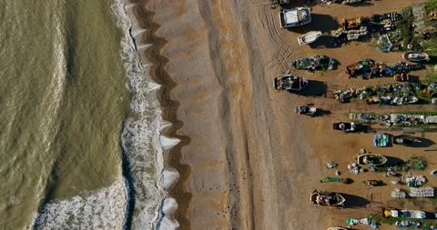 Top-down drone shot of fishing boats on a beach Stock Footage 345585232