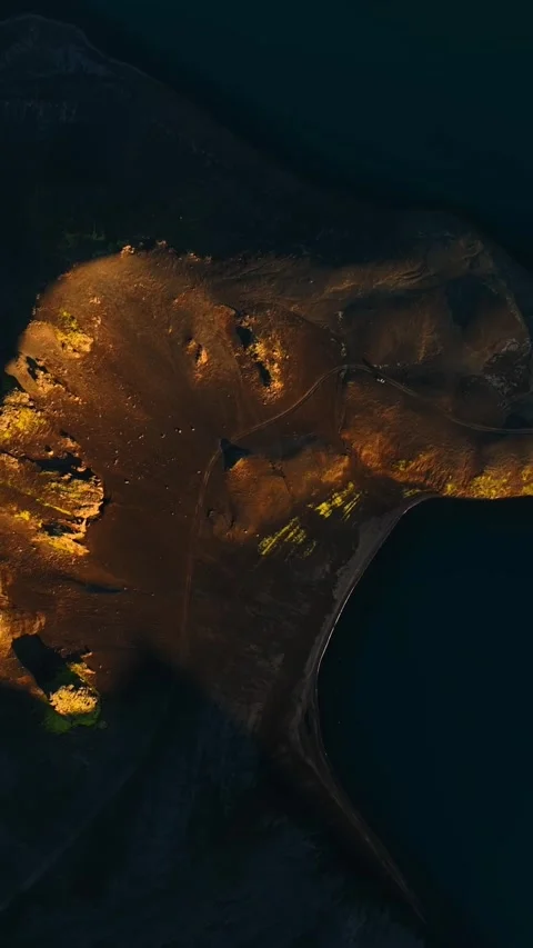 Top-down drone shot of a golden sandbank peninsula in dark blue water, with Stock-Footage 330901697