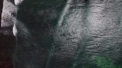 Top-Down Drone Shot Moving Along Coastline with Shallow Waters, Reflections, Roc Stock Footage 306313841