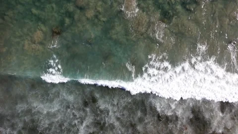 Top Down Drone Shot Moving Toward Ocean Waves Breaking in 4K Stock Footage 331766417
