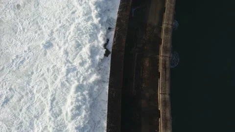 Top down drone shot of ocean waves crashing Stock Footage 226022624