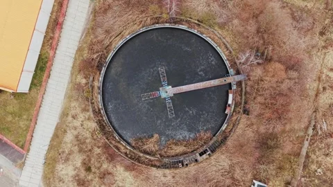 Top down drone shot of an old circular sewage clarifier tank in Zduny, Poland Stock Footage 329191794