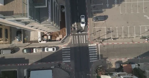 Top down drone shot over city streets, real life footage. Stock Footage 97846467