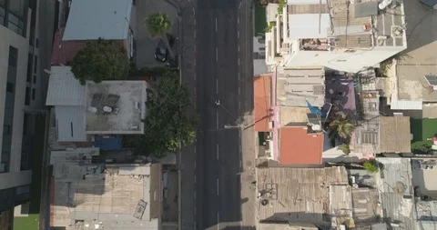 Top down drone shot over city streets, real life footage. Stock Footage 97846574