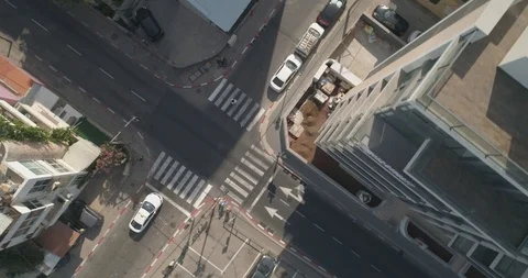 Top down drone shot over city streets, real life footage. Stock Footage 97846868
