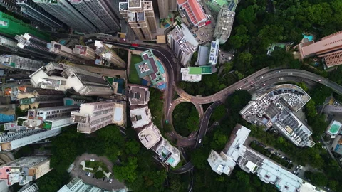 Top down drone shot over skyscrapers in downtown Hongkong, cloudy day Video stock 324943993