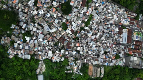 Top down drone shot over a favela slum in sunny Rio de Janeiro, cloudy Brazil Vídeo Stock 328492978