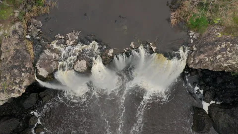 Top Down Drone Shot On Precipice of Wannon Falls White Water Crashes Over Stock Footage 249640423