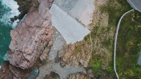 Top Down Drone Shot of Red Rocky Coastal Cliff Shore Stock-Footage 232250050