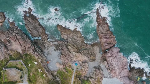 Top Down Drone Shot of Rugged Rocky Coastline Waves Stock-Footage 231991914