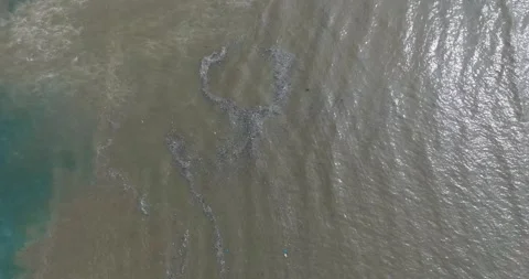 Top down drone shot of sewage water in ocean, Bali Indonesia Stock Footage 267516148