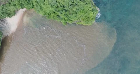 Top down drone shot of sewage water in ocean, Bali Indonesia Stock Footage 267516175