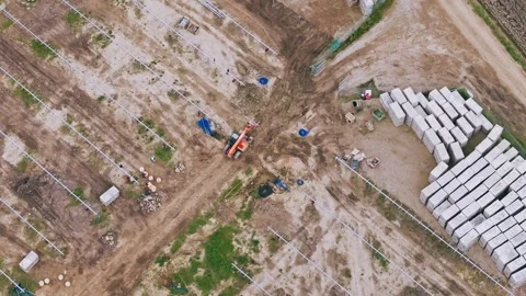 Top Down Drone Shot of Solar Farm Construction with Tractor and Workers 스톡 동영상 332052555
