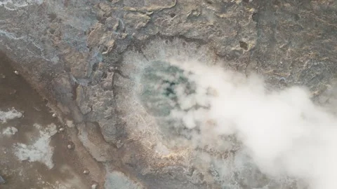 Top-down drone shot of steaming Strokkur geyser, Iceland Stock Footage 279666449