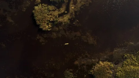 Top down drone shot of SUP boarder on lake Stock Footage 127291874