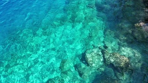 Top Down Drone Shot of Turquoise Water with Underwater Rock Formations Stock Footage 317201743