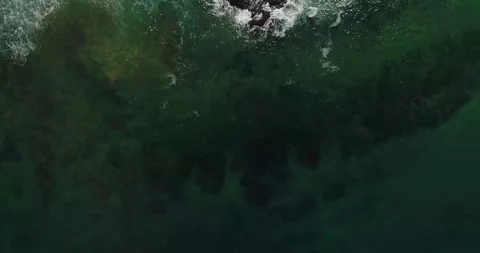 Top Down Drone Shot Waves Crushing against the rock pool Sydney Beach Stock Footage 115703162