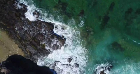 Top Down Drone Shot Waves Crushing against the rocks Stock Footage 115758995
