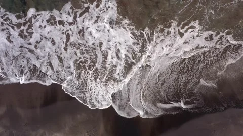 Top-Down Drone Shot of Waves on Black Sand Beach – Martinique Stock Footage 317651556
