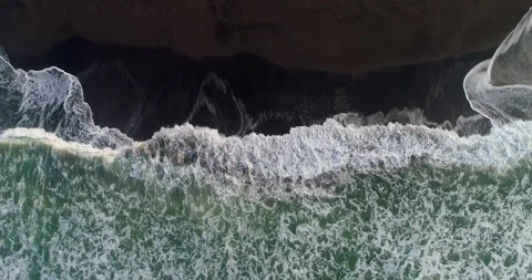 Top Down Drone Shot of Waves Rolling Over Tropical Beach Shore Stock Footage 329657711