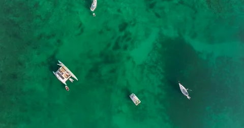 Top down drone shot, yachts in clear blue water Stock Footage 343622615