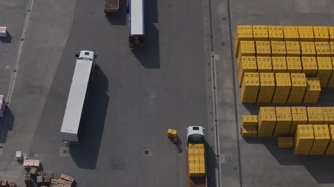 Top down drone shows forklift loading aerated concrete blocks onto truck in Stock Footage 334712275