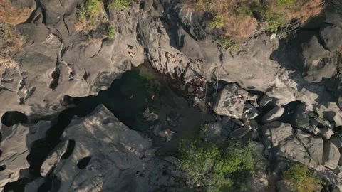 Top down drone slide above quartzite plunge pool at Vale da Lua Brazil Stock Footage 341658607