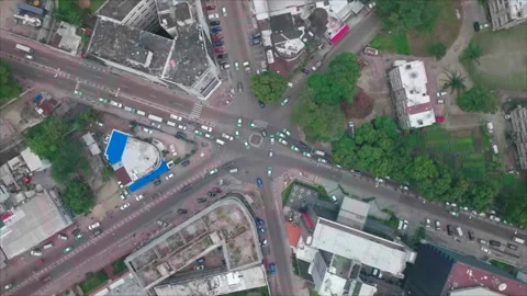 Top-down drone spinning over six-street intersection, Brazzaville, Congo Stock Footage 331999237