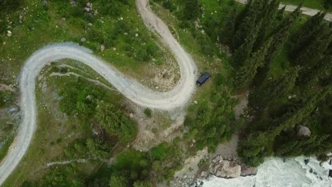 Top-down Drone Tracking Over Winding Road And SUV. Kyrgyzstan, Karakol Stock-Footage 332778783