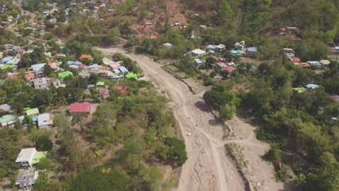 Top down drone video of dry river in Dili city in East Timor Video stock 262439184