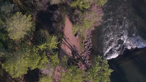 Top down drone video of a runner on the Greenbelt in Boise, Idaho Stock Footage 339504077