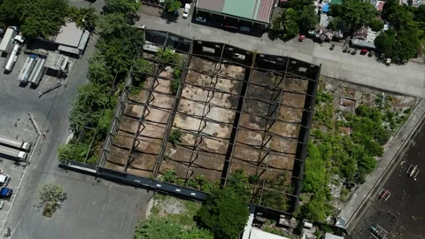 Top down drone view of abandoned industrial warehouse with rusted steel frame Stock Footage 337849435