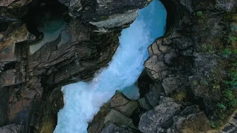 Top-down drone view above the stormy azure water a stone gorge Video stock 139117121
