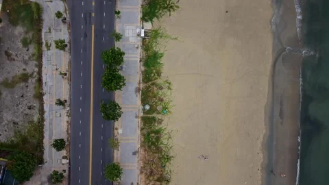 Top down drone view of beach, coastal road and waves in Da Nang, Vietnam Stock Footage 340597577