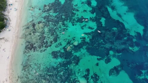 Top-Down Drone View of Boats Floating Near Sandy Beach at La Marmorata, Vídeo Stock 332606712