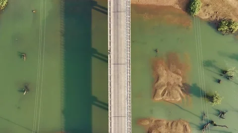 Top down drone view of a bridge with low traffic in Thalang, Laos Stock Footage 247866167