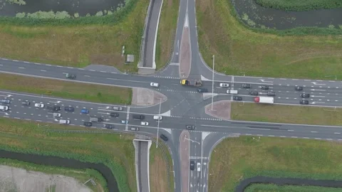 Top down drone view of busy road intersection with traffic Stock Footage 343838993
