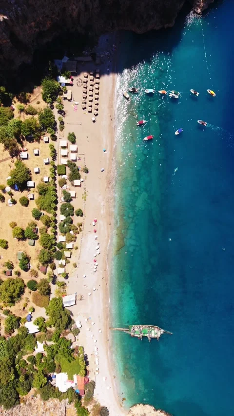 Top down drone view Butterfly Valley beach at high tide in Turkey Stock Footage 345542400