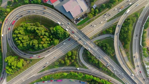 Top Down Drone View of Circular Highway Interchange and Expressway Traffic 動画素材 332201931