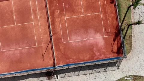 Top-Down Drone View of Clay Tennis Court Maintenance in Sao Paulo Stock-Footage 344577495