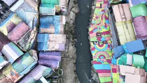 Top Down Drone View of Colorful Riverside Neighborhood in Indonesia Stock Footage 340542555