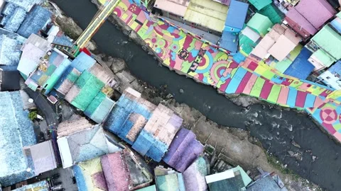 Top Down Drone View of Colorful Riverside Neighborhood in Indonesia Stock Footage 340542666